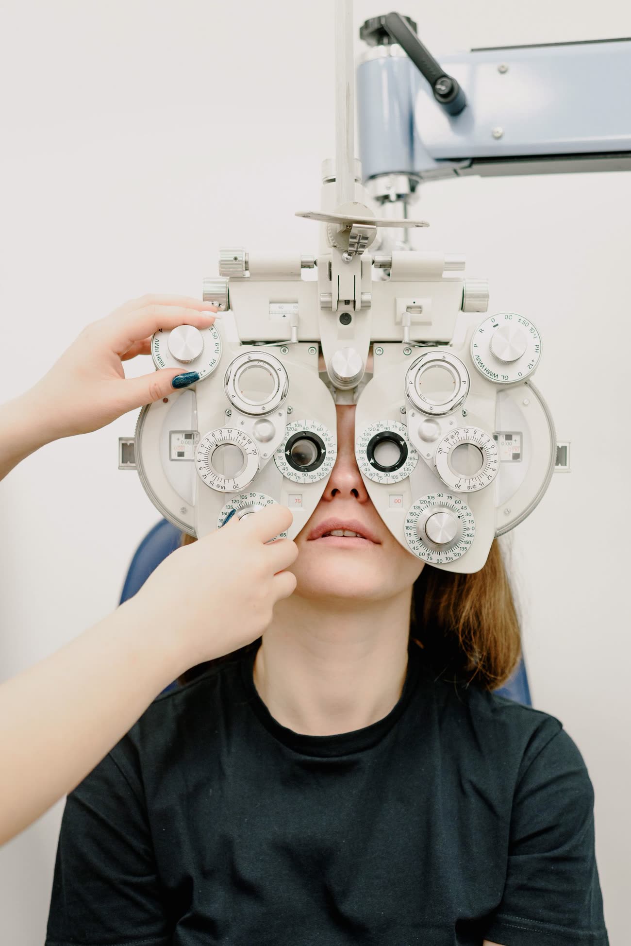 An optometrist performing an eye exam